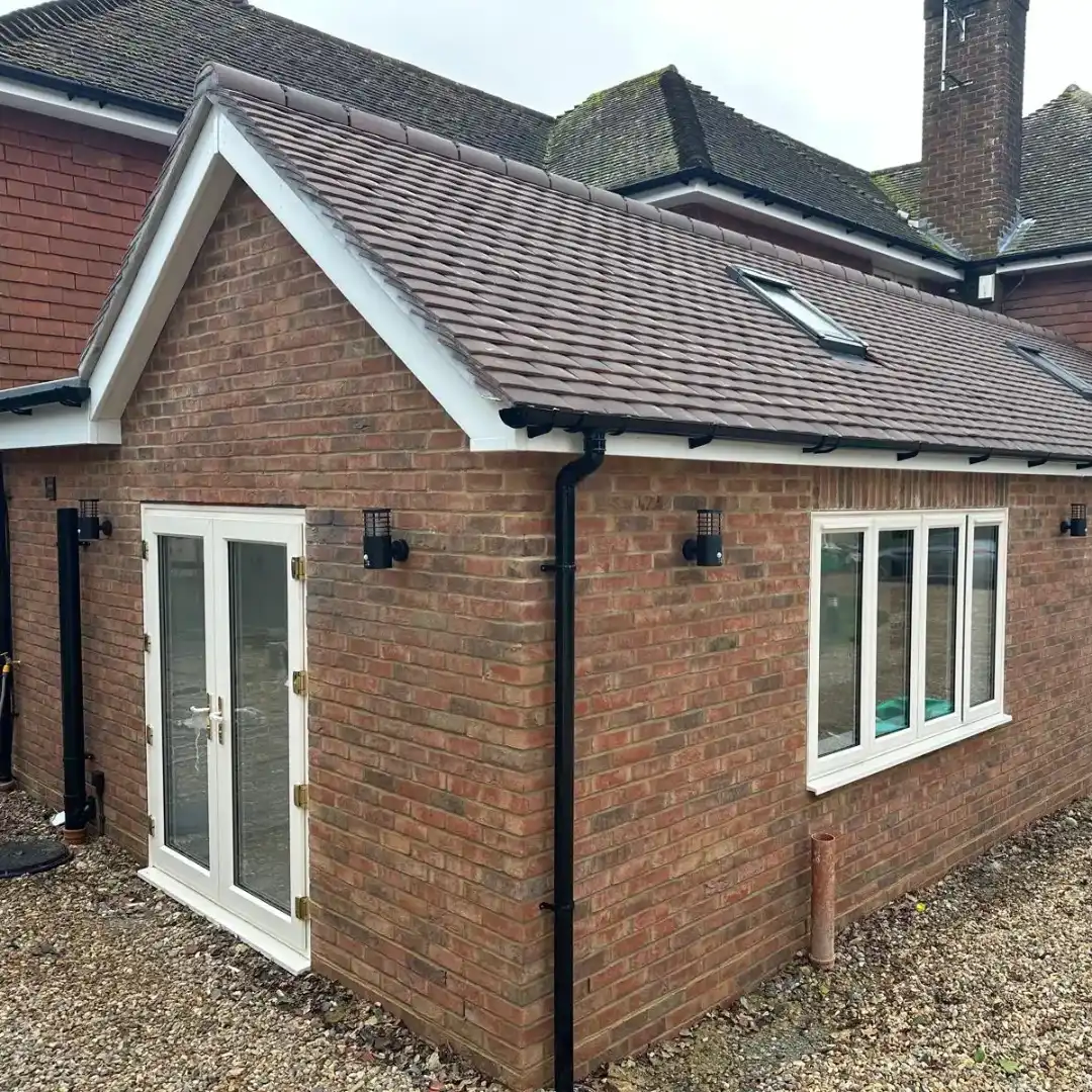 House exterior with outdoor lighting in West Sussex
